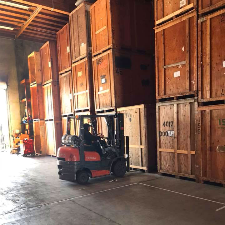 Poulos Moving Storage and Warehouse Man on Forklift Moving Storage Pod